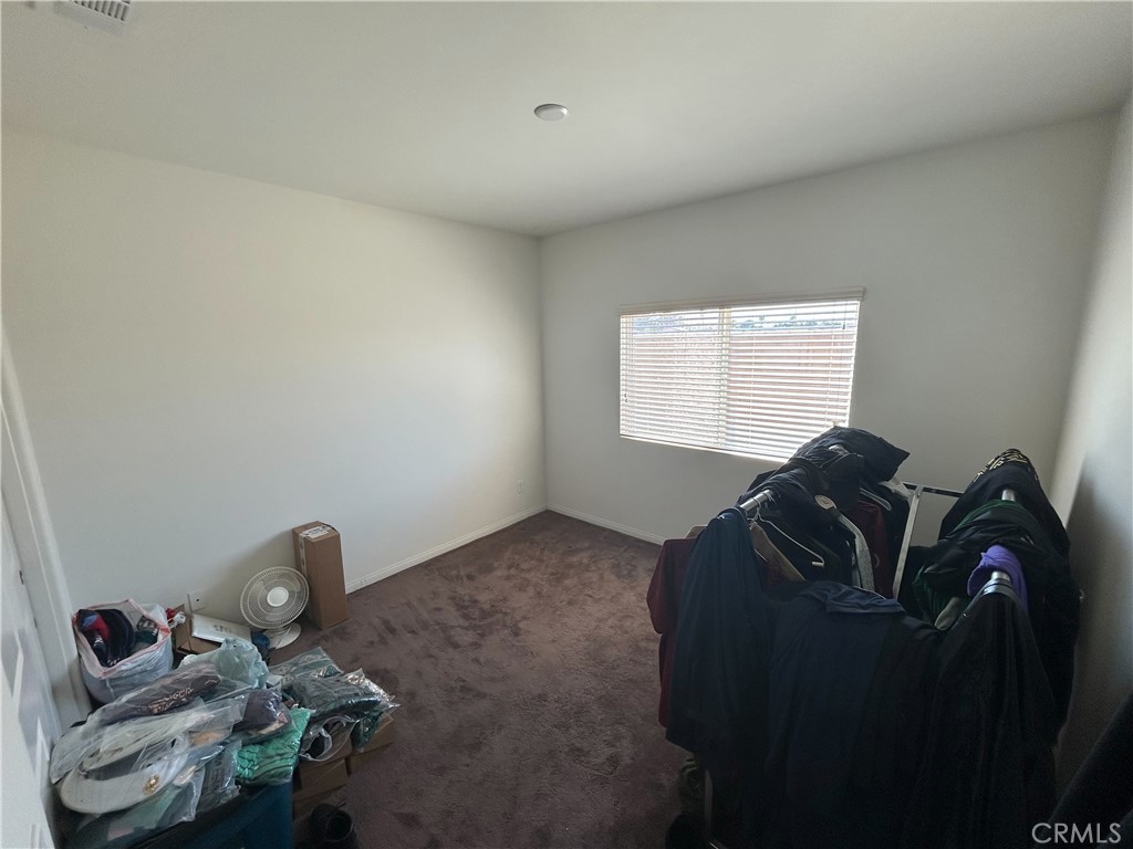 772 St Alban Road San Jacinto, CA 92583 - Photo 16 of 25 a living room with furniture and a window