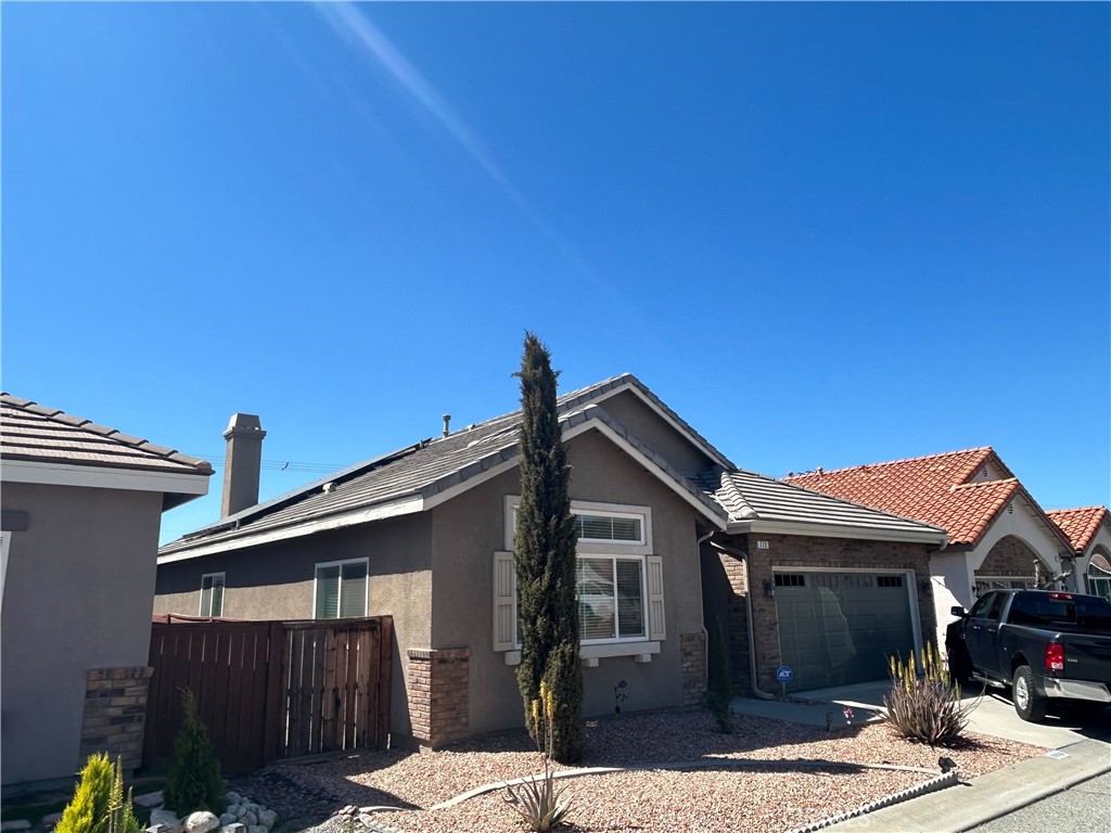 772 St Alban Road San Jacinto, CA 92583 - Photo 4 of 25 a front view of a house with parking