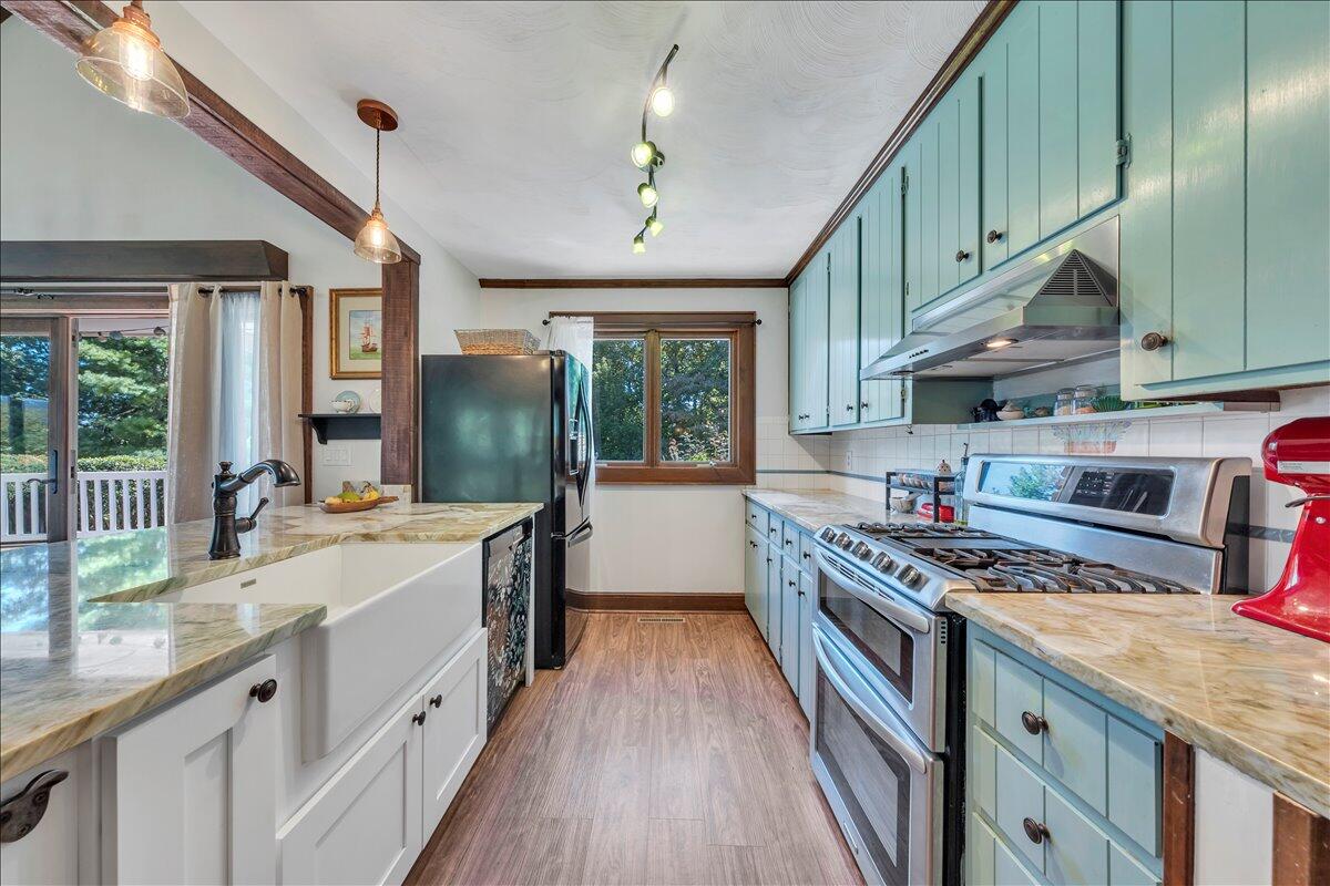280 Woodwinds Road Callaway, VA 24067 - Photo 11 of 97 a kitchen with stainless steel appliances granite countertop a stove and a sink