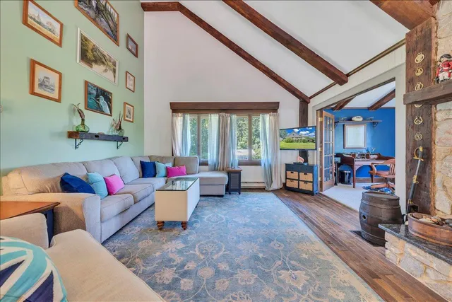 a lobby with furniture and potted plants