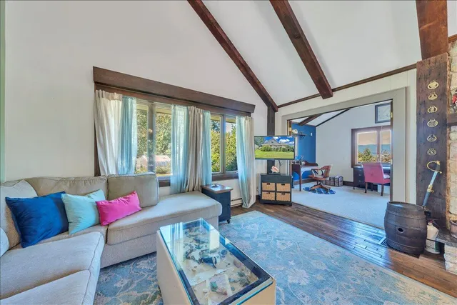 a bedroom with a bed and a table