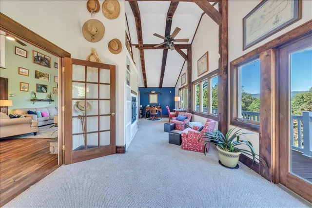 a view of a balcony with wooden floor