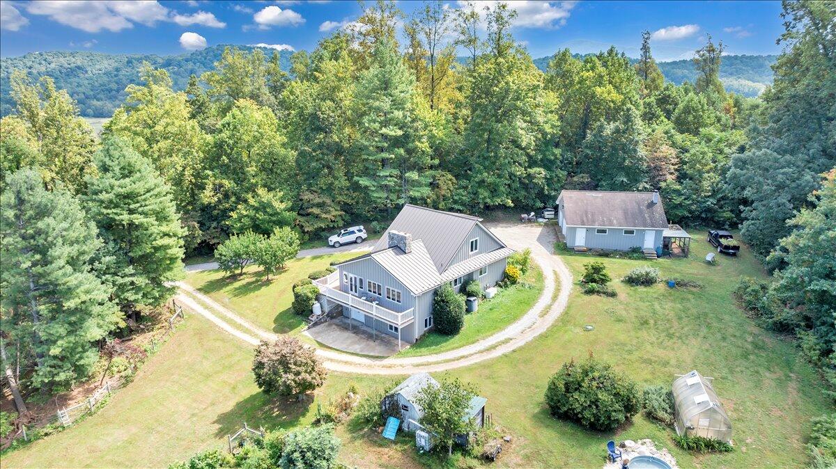 280 Woodwinds Road Callaway, VA 24067 - Photo 5 of 97 an aerial view of a house with a garden and swimming pool