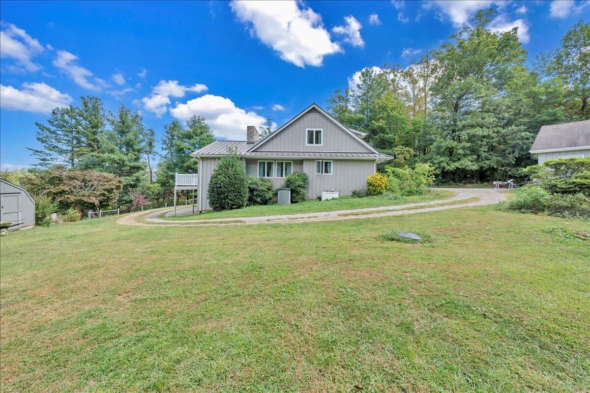 280 Woodwinds Road Callaway, VA 24067 - Photo 61 of 97 a front view of a house with a garden