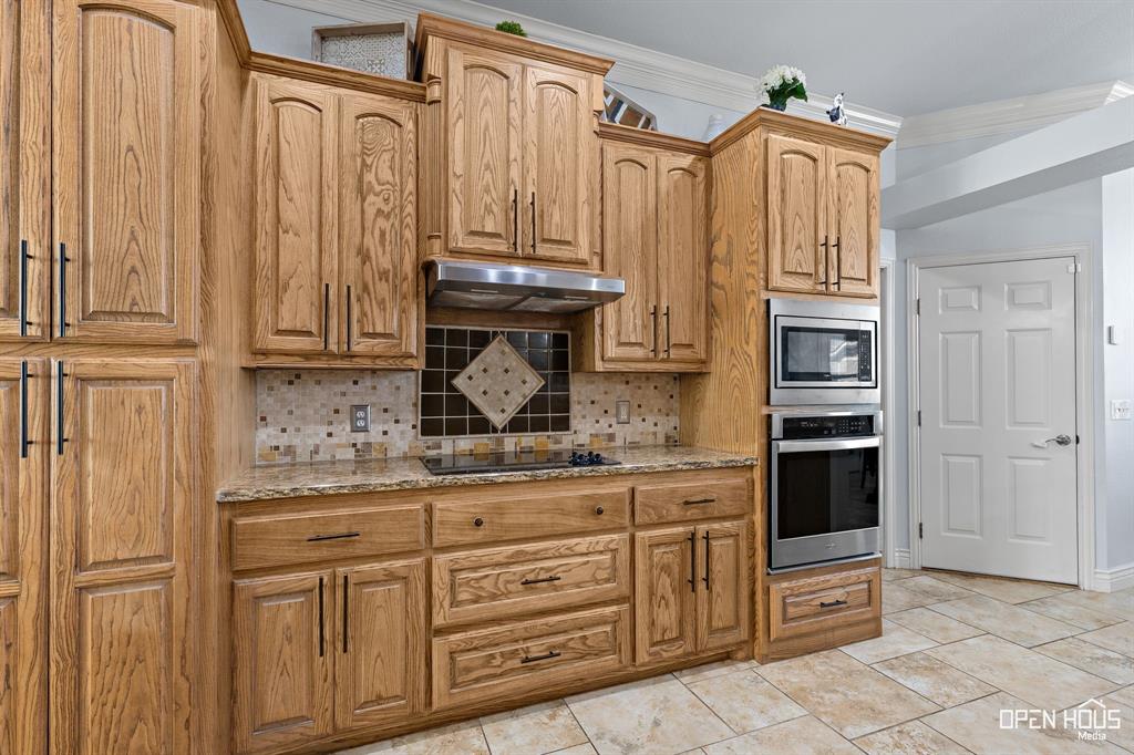 5401 Tanner Drive Wichita Falls, TX 76310 - Photo 13 of 30 a kitchen with cabinets and a wooden floor