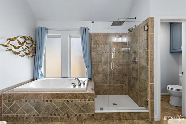 a bathroom with a bathtub and a shower