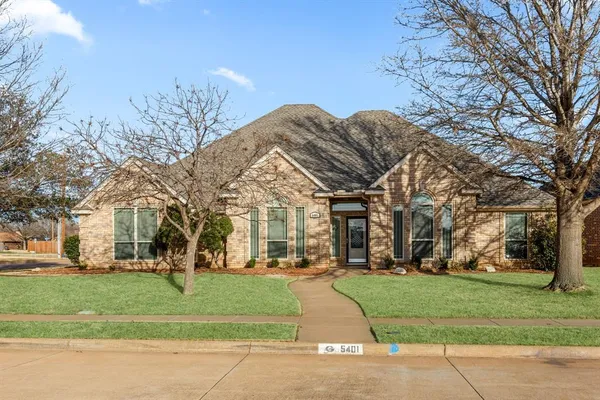 a view of a building with a yard