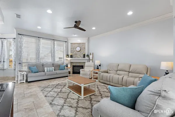 a living room with furniture and a fireplace