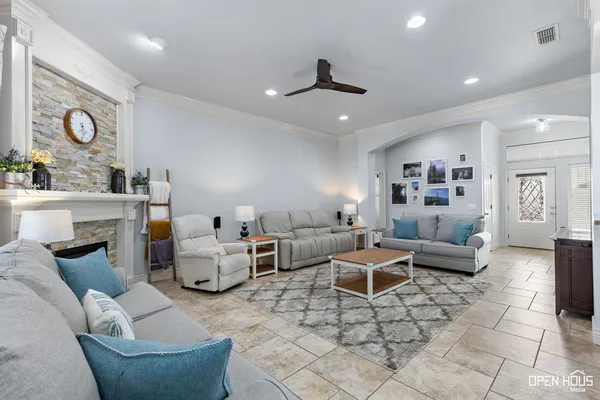 a living room with furniture and a fireplace