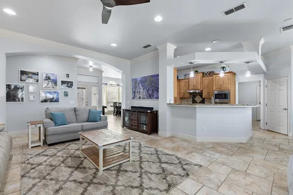 a living room with fireplace furniture and a fireplace