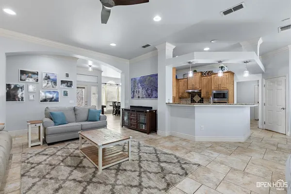 a living room with fireplace furniture and a fireplace