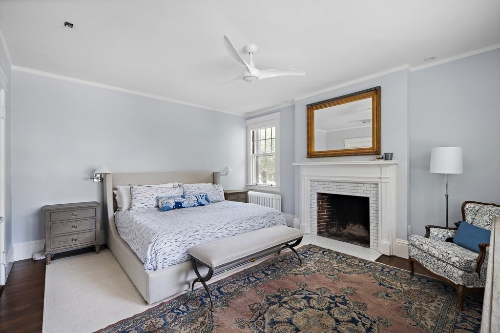 64 Williston Road Brookline, MA 02445 - Photo 11 of 29 a bedroom with a bed and a couch