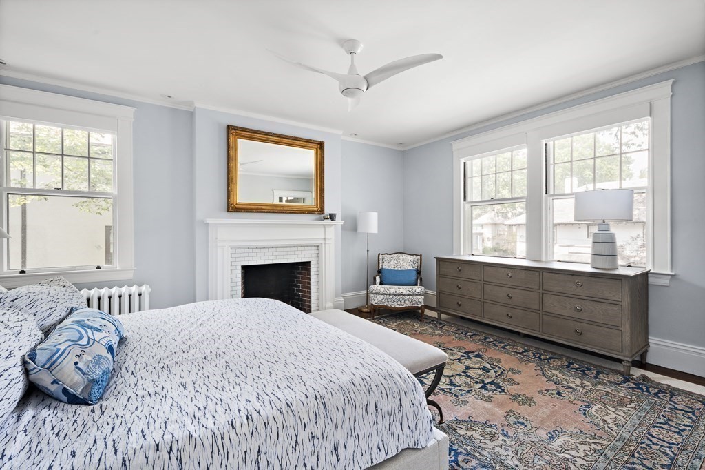 64 Williston Road Brookline, MA 02445 - Photo 12 of 29 a spacious bedroom with a large bed and a window