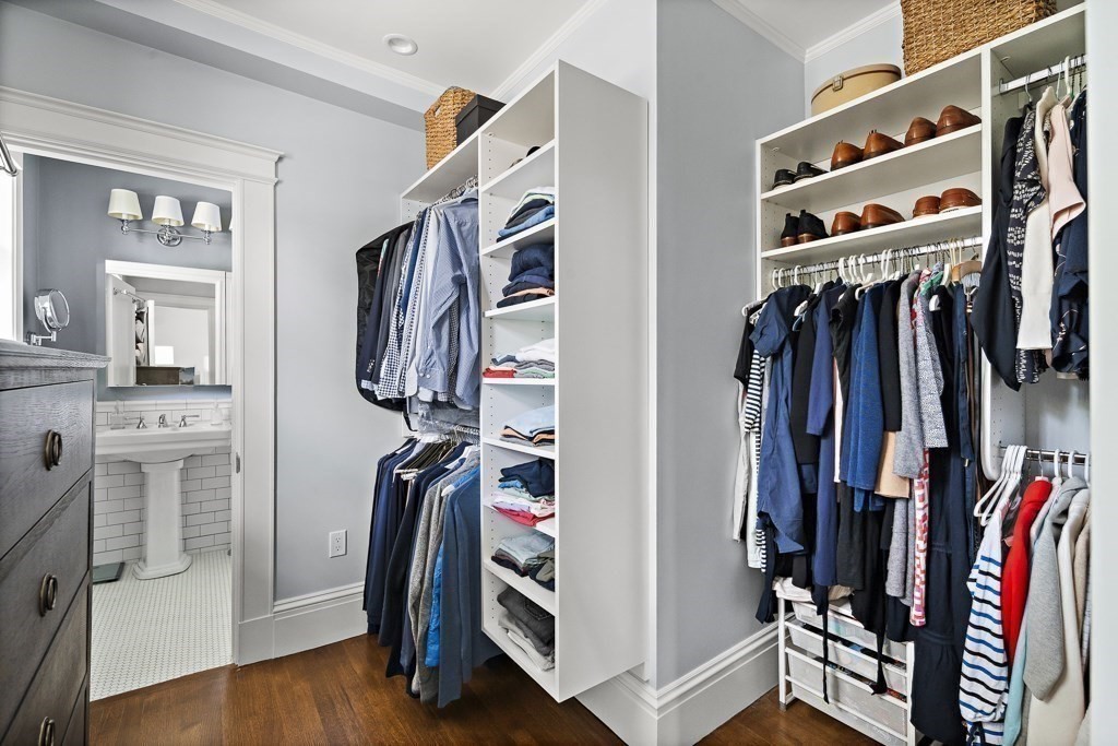64 Williston Road Brookline, MA 02445 - Photo 13 of 29 a view of walk in closet with clothes and shoes