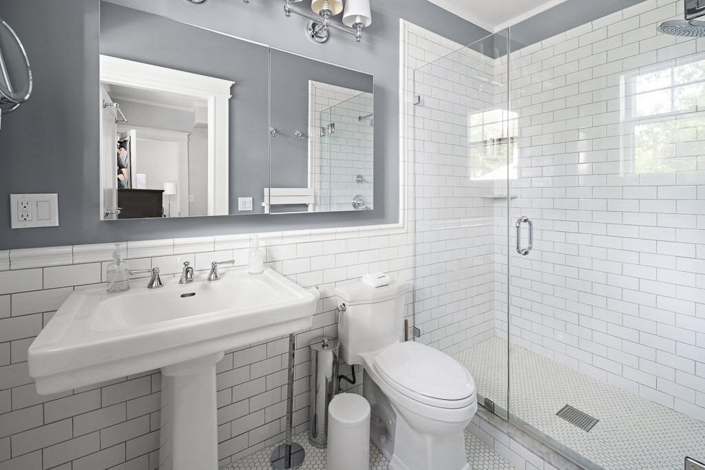 64 Williston Road Brookline, MA 02445 - Photo 14 of 29 a bathroom with a sink toilet and mirror