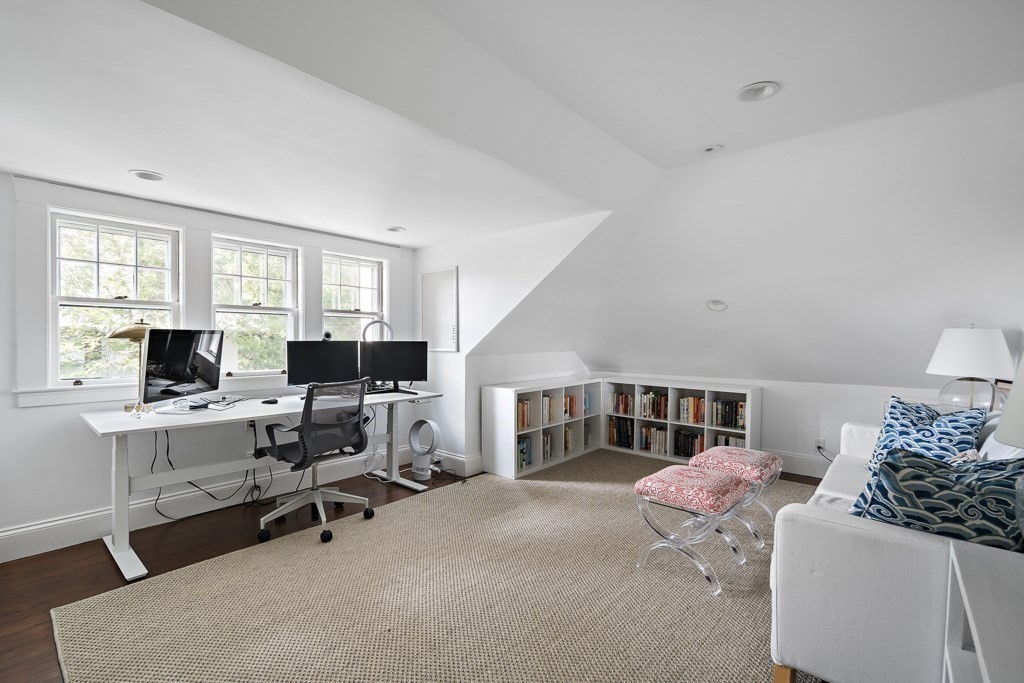 64 Williston Road Brookline, MA 02445 - Photo 19 of 29 a workspace with a large window and a chair