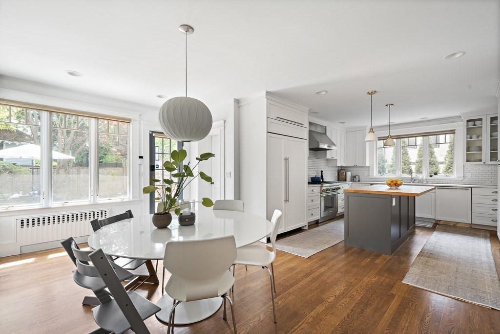 64 Williston Road Brookline, MA 02445 - Photo 5 of 29 a dining room with furniture a chandelier and wooden floor
