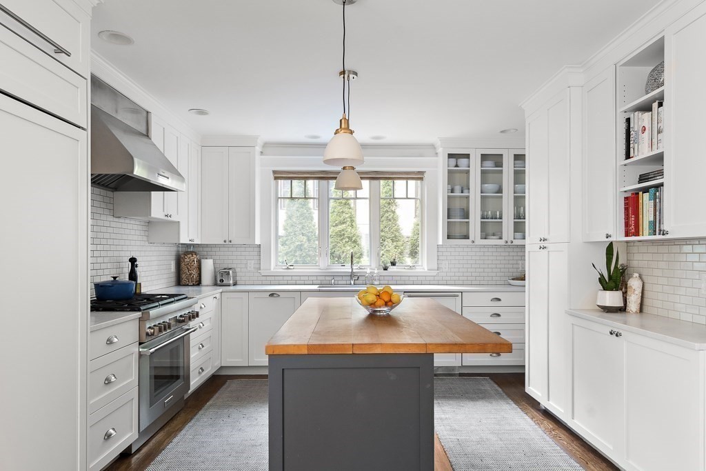 64 Williston Road Brookline, MA 02445 - Photo 6 of 29 a kitchen that has a lot of cabinets in it