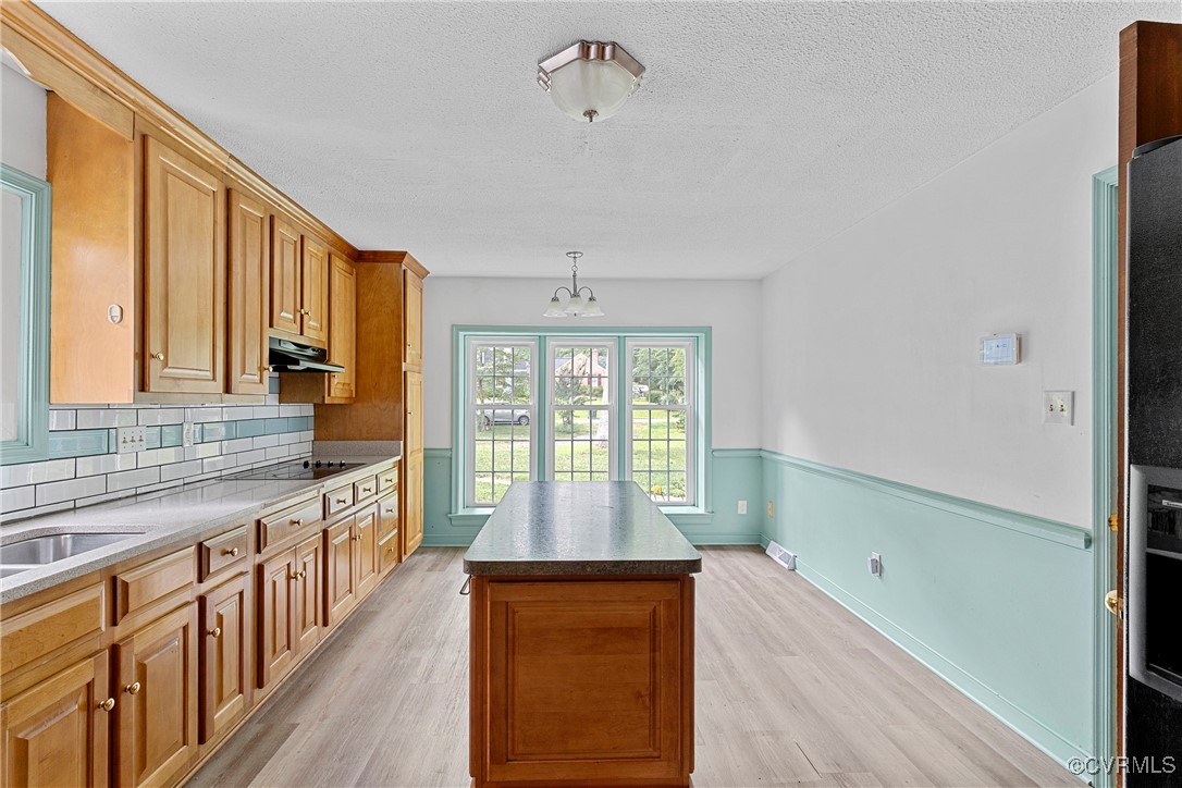 3223 Wood Dale Road Chester, VA 23831 - Photo 12 of 45 Kitchen with black electric cooktop, light wood-st