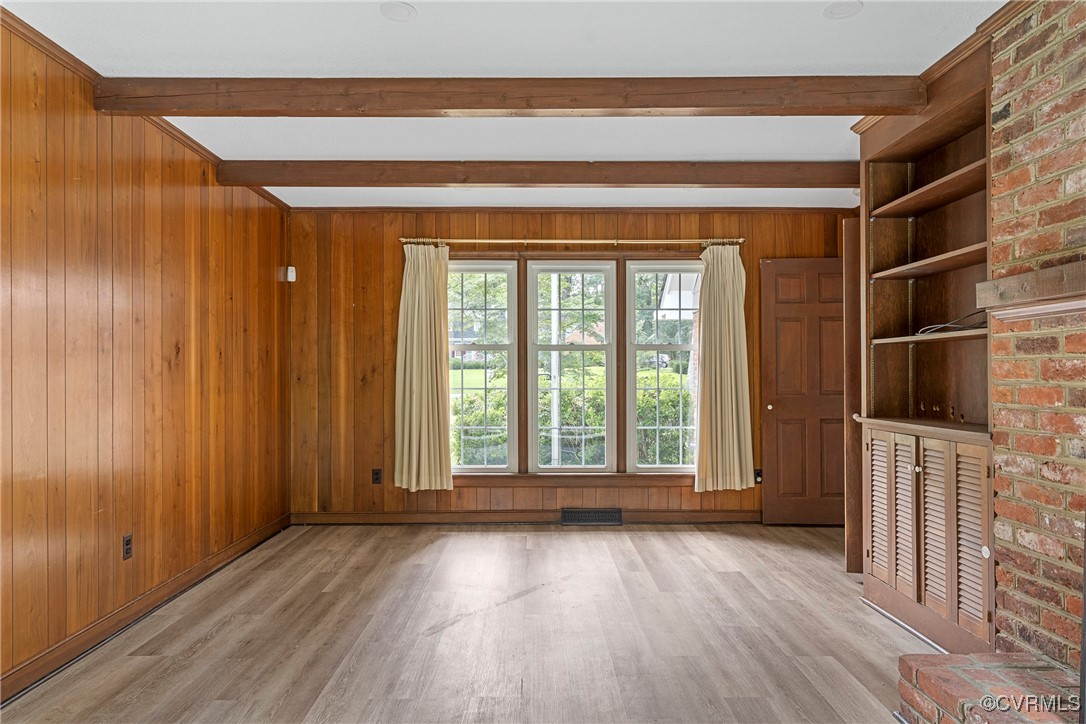 3223 Wood Dale Road Chester, VA 23831 - Photo 17 of 45 Unfurnished living room with beam ceiling, wood fi