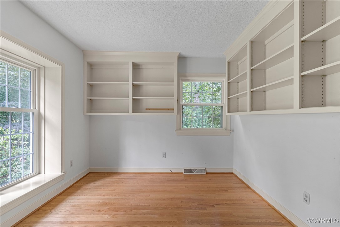 3223 Wood Dale Road Chester, VA 23831 - Photo 21 of 45 Empty room with plenty of natural light, a texture