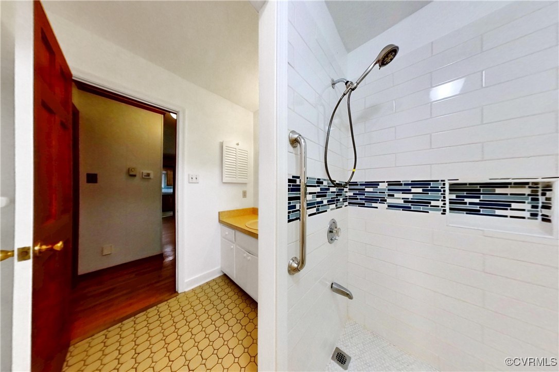 3223 Wood Dale Road Chester, VA 23831 - Photo 27 of 45 Bathroom with a shower stall, vanity, and tile pat