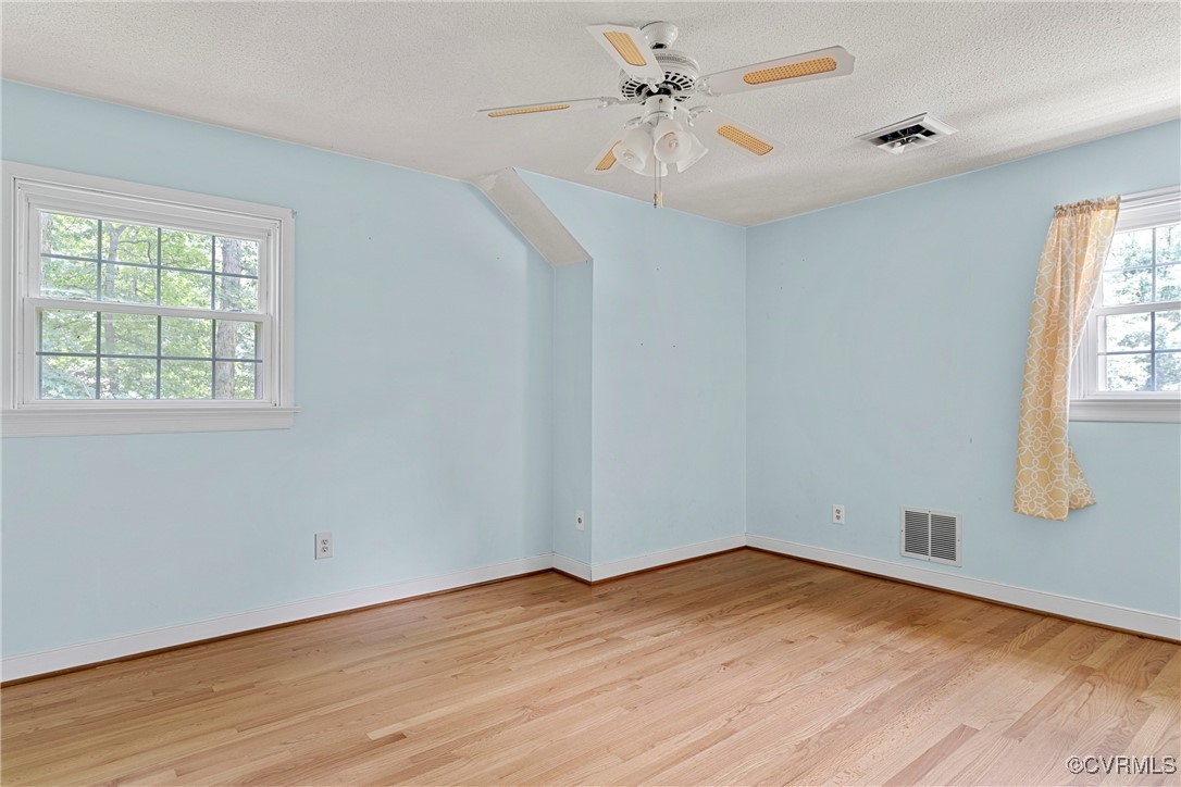 3223 Wood Dale Road Chester, VA 23831 - Photo 35 of 45 Spare room featuring light wood-type flooring, cei