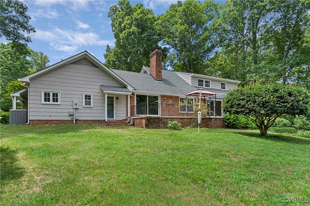 3223 Wood Dale Road Chester, VA 23831 - Photo 44 of 45 Rear view of property with a chimney, a yard, and
