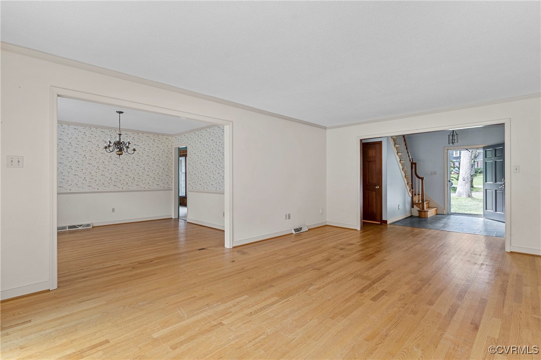 3223 Wood Dale Road Chester, VA 23831 - Photo 6 of 45 Unfurnished room with a chandelier, stairway, ligh
