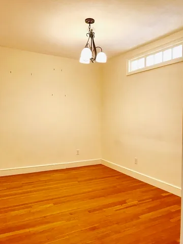 a kitchen with wooden floors and a sink