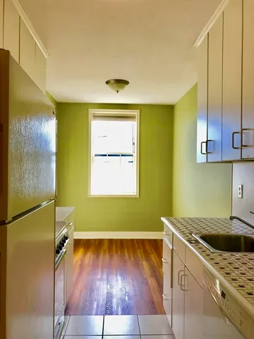 a bathroom with a shower and a sink