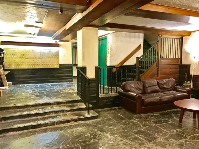 a room with furniture and a ceiling fan