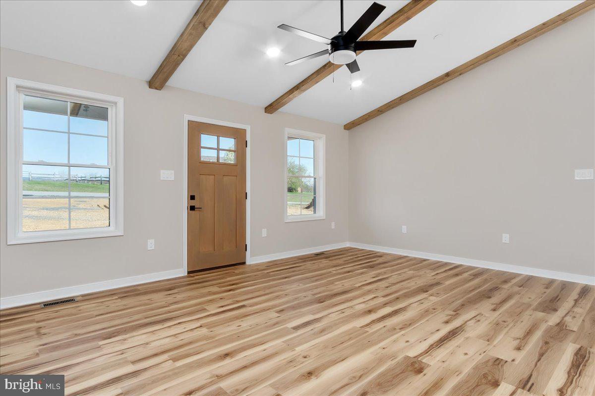 14630 Bain Road Hancock, MD 21750 - Photo 11 of 51 a view of an empty room with wooden floor and a window