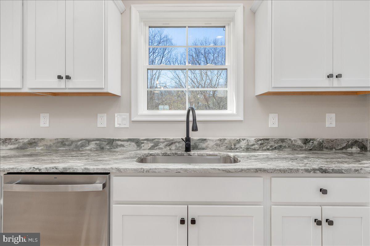14630 Bain Road Hancock, MD 21750 - Photo 18 of 51 a kitchen with granite countertop white cabinets and window