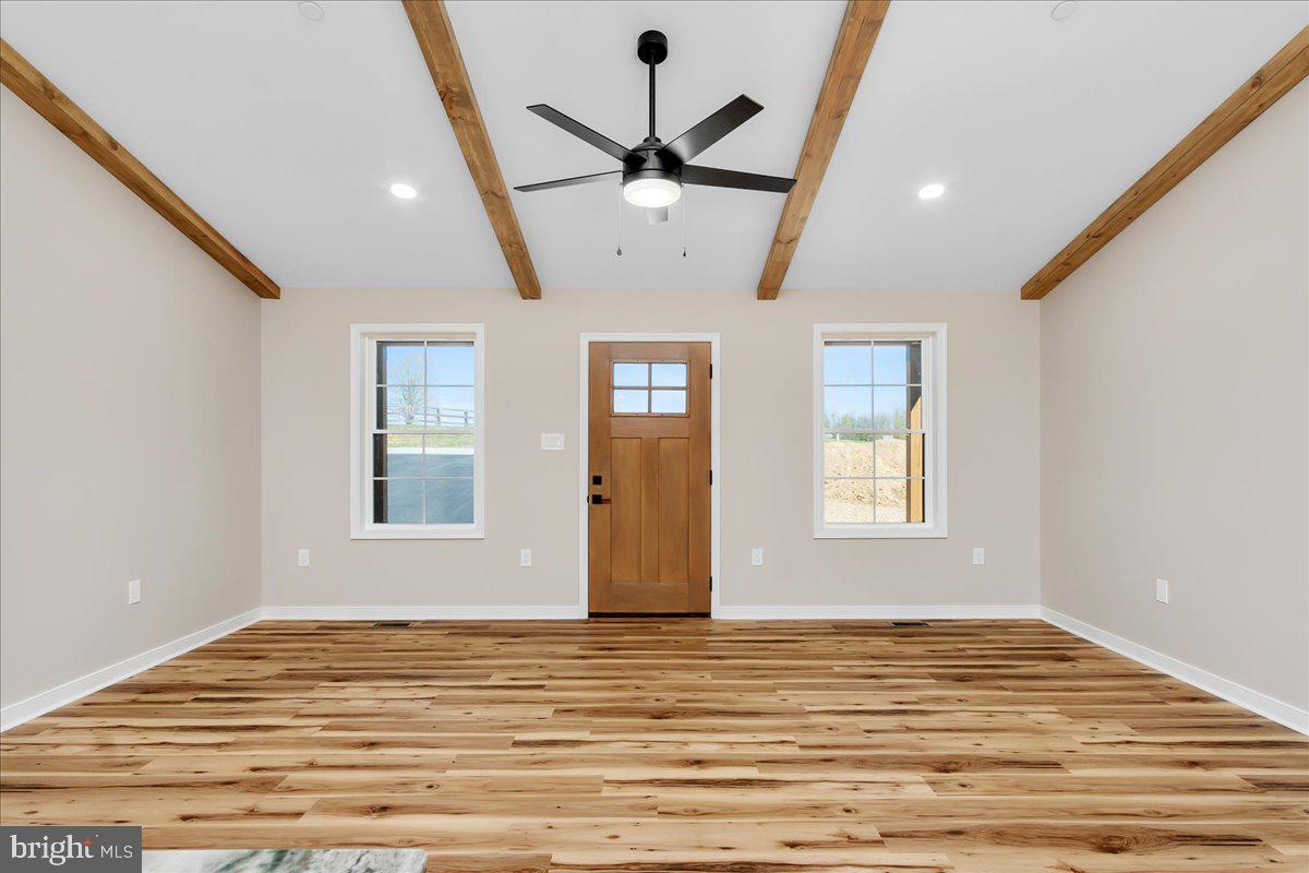 14630 Bain Road Hancock, MD 21750 - Photo 10 of 51 a view of an empty room with a window and wooden floor