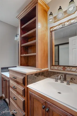 a view of a sink and a mirror