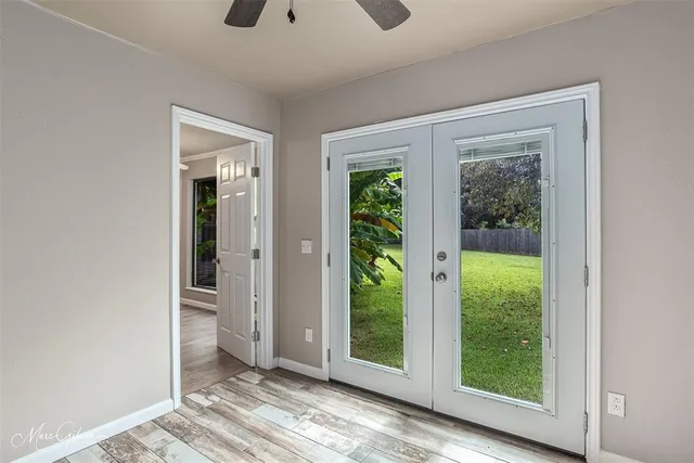 an empty room with windows and closet