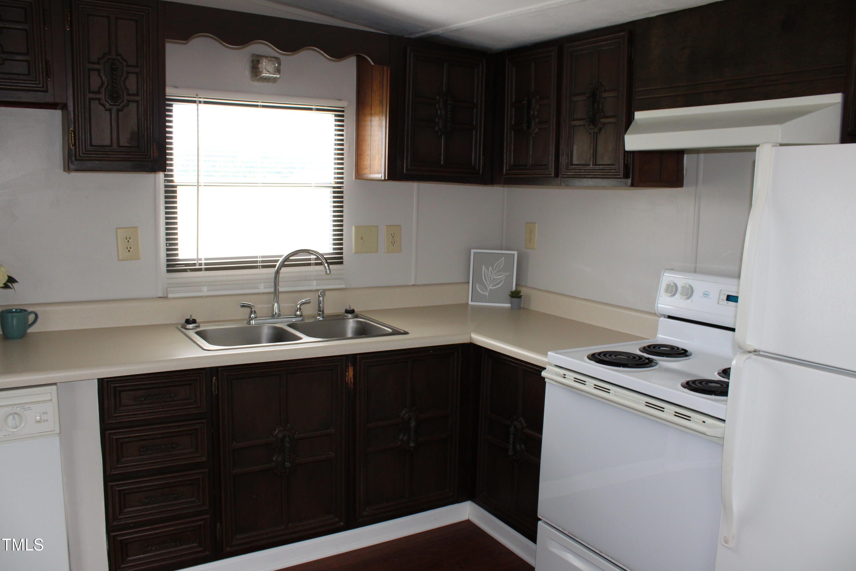 841 Chalybeate Springs Road Angier, NC 27501 - Photo 19 of 24 a kitchen with a sink cabinets and window