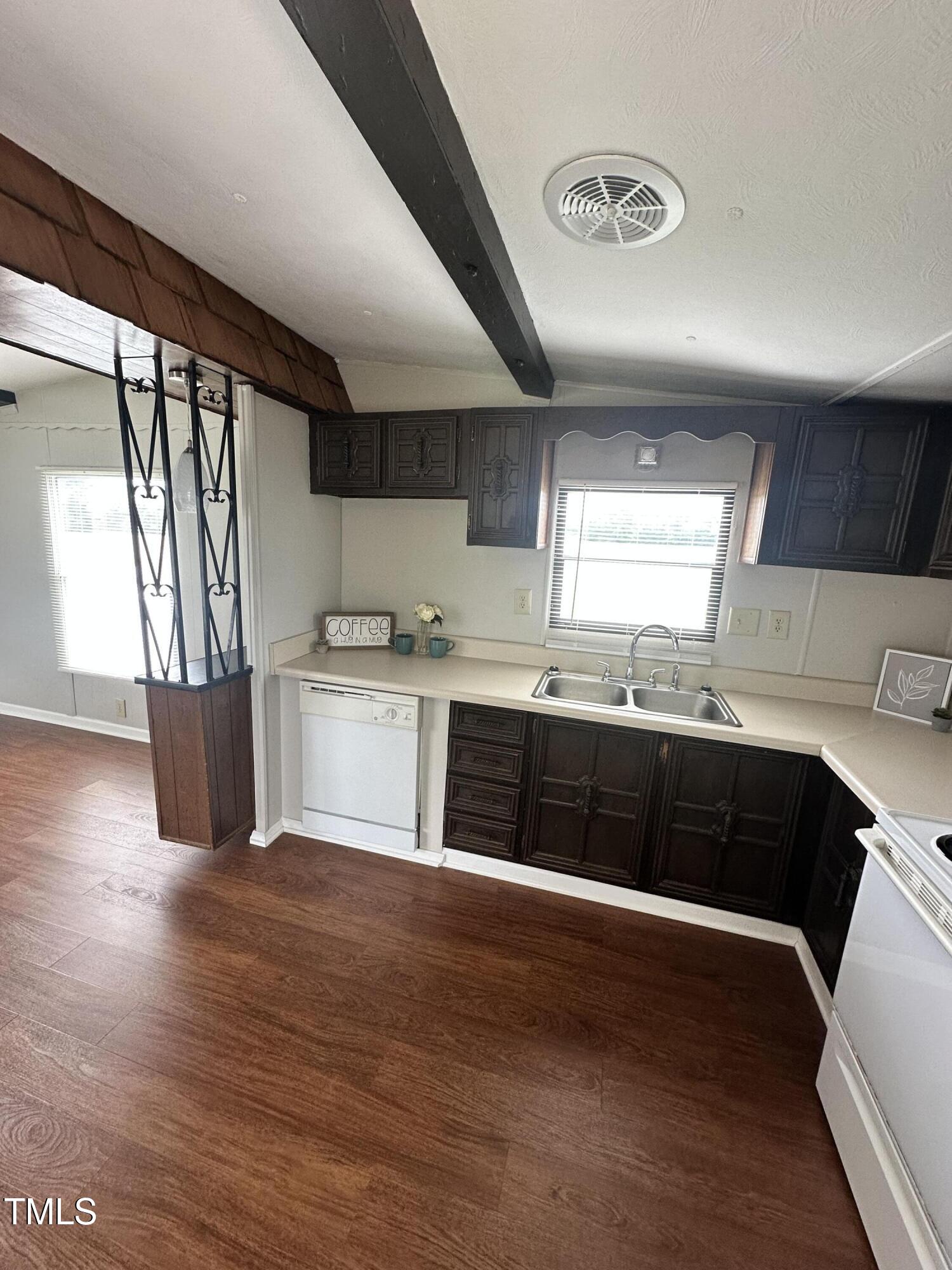 841 Chalybeate Springs Road Angier, NC 27501 - Photo 4 of 24 a kitchen with stainless steel appliances granite countertop a stove a sink and a refrigerator