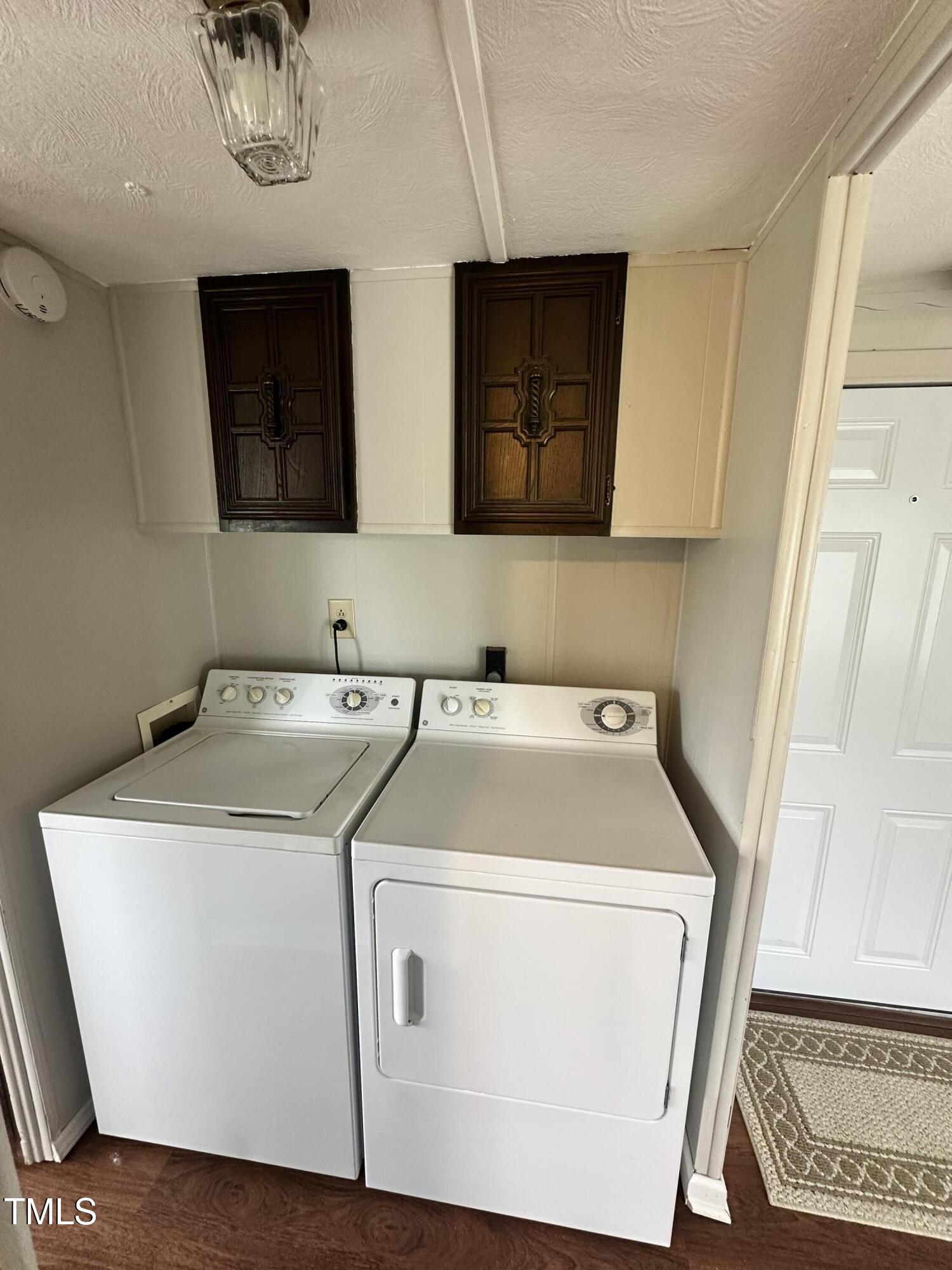 841 Chalybeate Springs Road Angier, NC 27501 - Photo 7 of 24 a utility room with dryer and washer