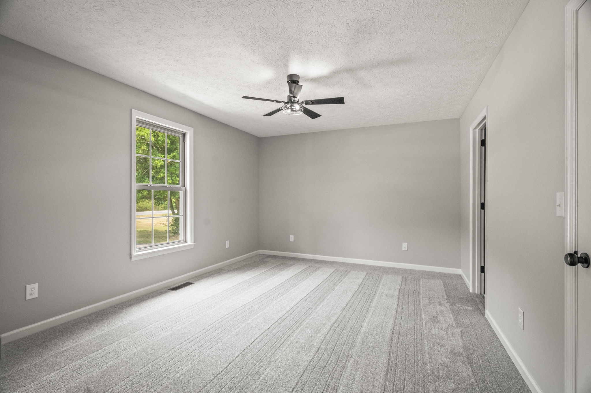 8861 Owens Chapel Road Springfield, TN 37172 - Photo 11 of 22 wooden floor in an empty room with a window