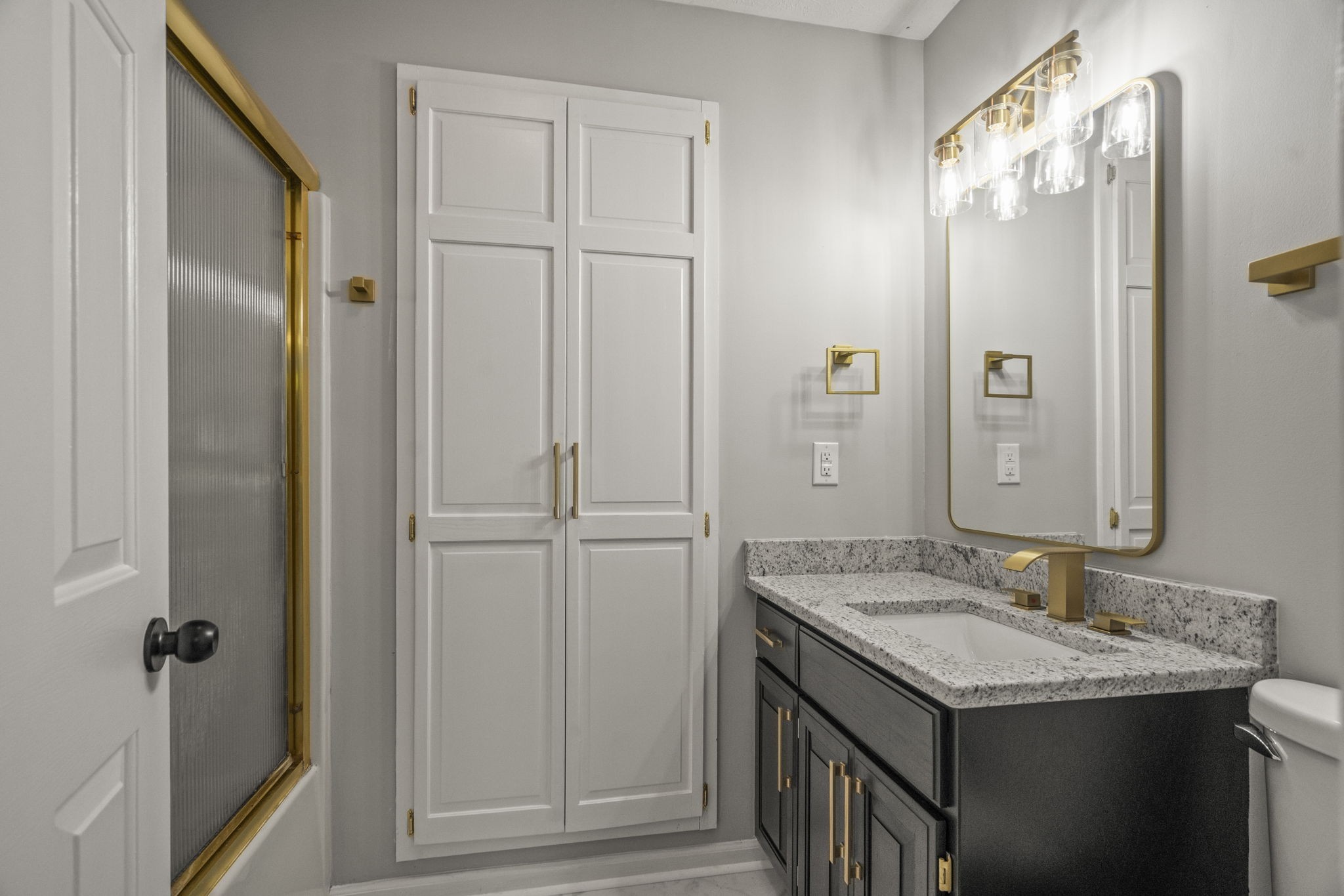 8861 Owens Chapel Road Springfield, TN 37172 - Photo 12 of 22 a bathroom with a granite countertop sink and a mirror