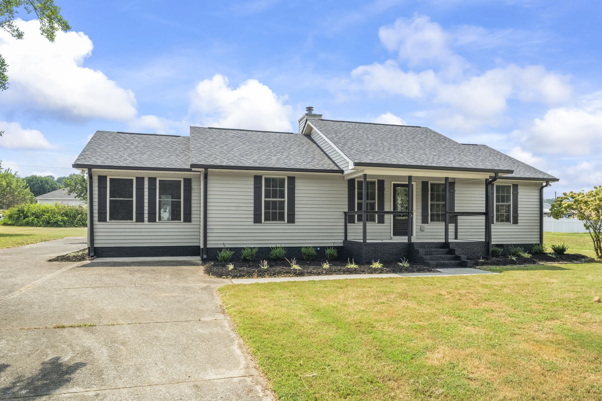 8861 Owens Chapel Road Springfield, TN 37172 - Photo 3 of 22 a front view of a house with a yard outdoor seating and barbeque oven