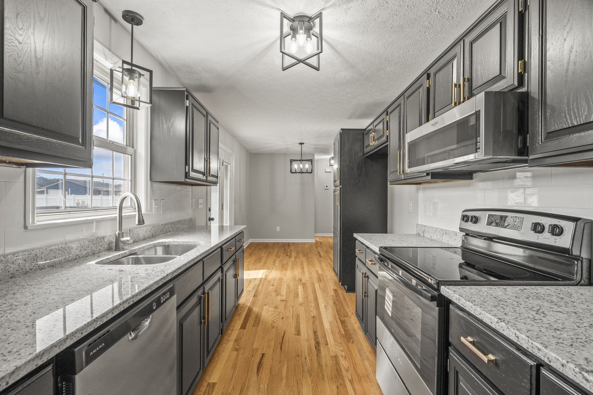 8861 Owens Chapel Road Springfield, TN 37172 - Photo 10 of 22 a kitchen with stainless steel appliances granite countertop a sink stove and refrigerator