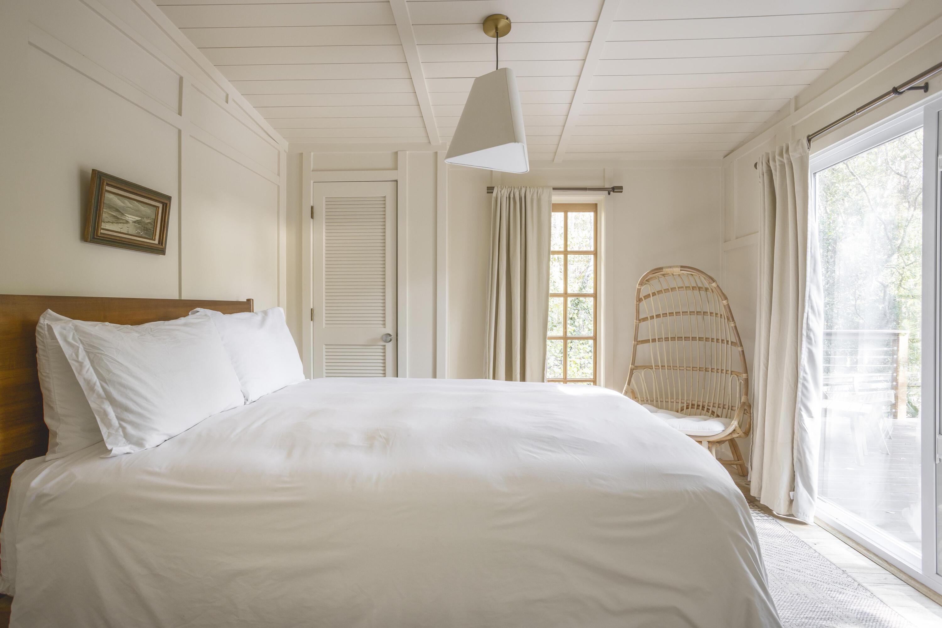 34 Pisces Drive Santa Rosa Beach, FL 32459 - Photo 39 of 70 a bedroom with a large bed and a chandelier