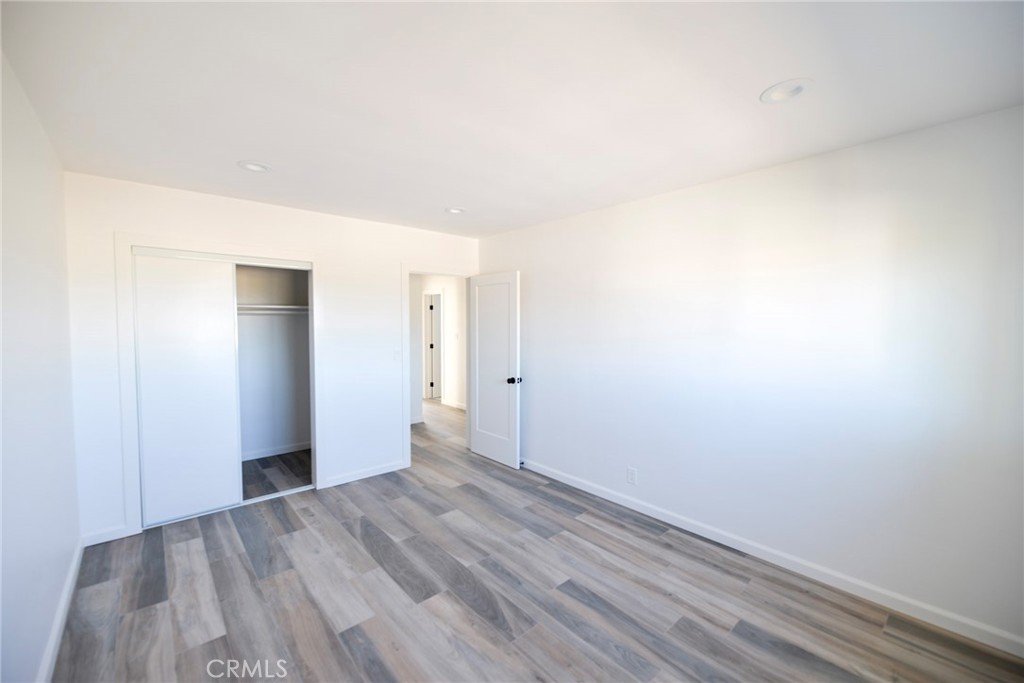 262 Avenida Victoria, Unit 4 San Clemente, CA 92672 - Photo 14 of 24 a view of an empty room with wooden floor