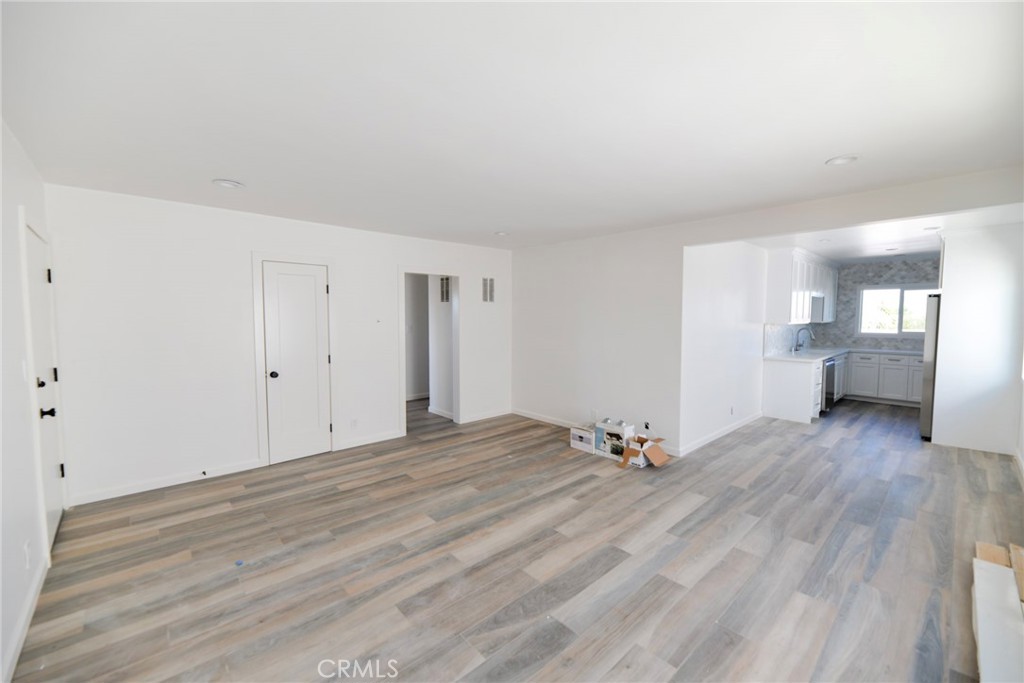 262 Avenida Victoria, Unit 4 San Clemente, CA 92672 - Photo 2 of 24 a view of empty room with wooden floor