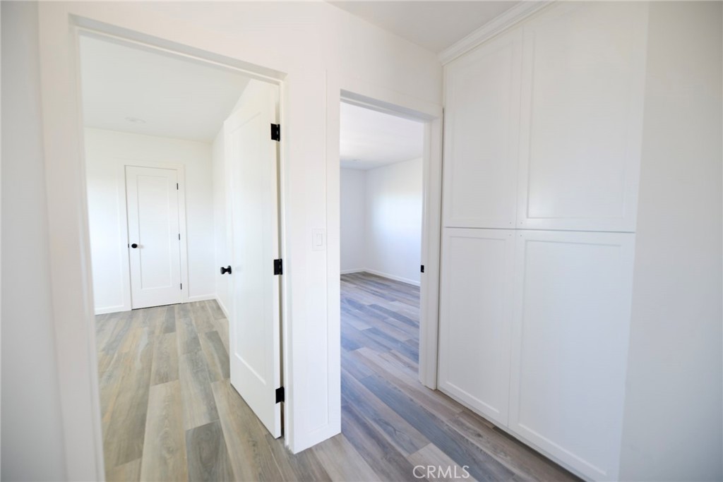 262 Avenida Victoria, Unit 4 San Clemente, CA 92672 - Photo 21 of 24 a view of a hallway with wooden floor