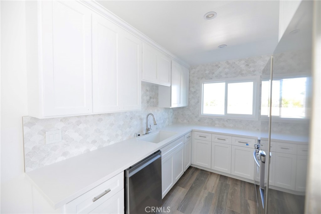 262 Avenida Victoria, Unit 4 San Clemente, CA 92672 - Photo 6 of 24 a kitchen with a sink cabinets and window