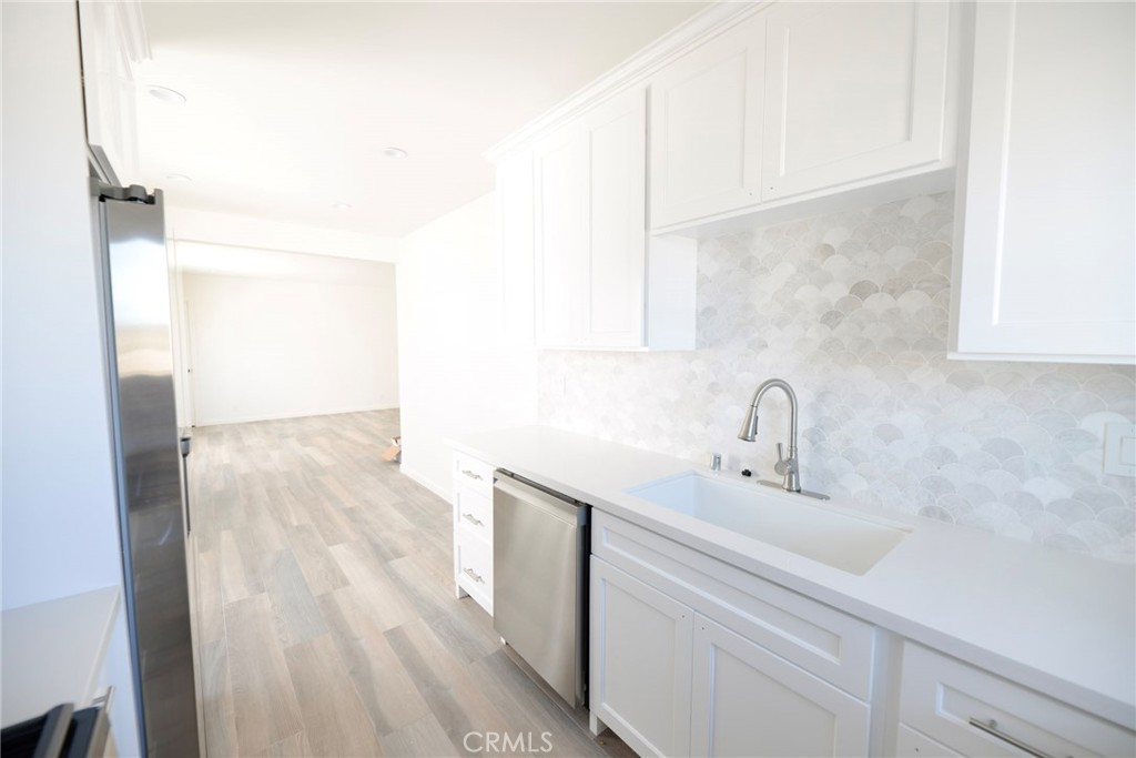 262 Avenida Victoria, Unit 4 San Clemente, CA 92672 - Photo 7 of 24 a bathroom with a sink and a mirror